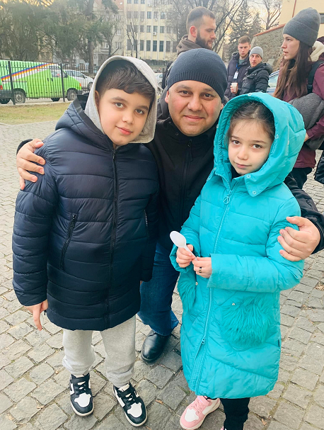 Myroslav welcoming Roma children with a group of 200 from Kharkov. He organises shelter, food, medicine and transportation for Roma families running away from the East of Ukraine.